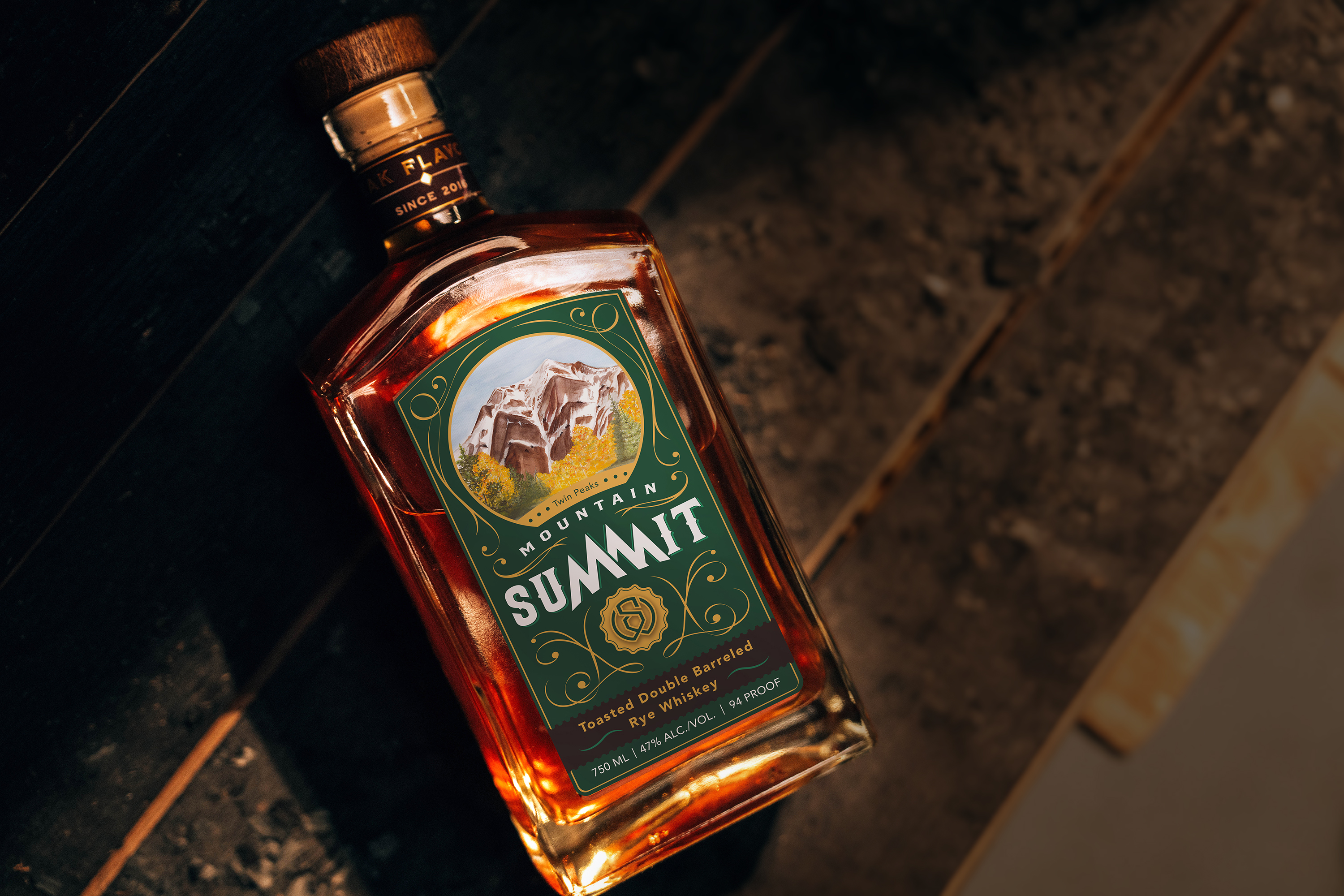 Mountain Summit: Toasted Rye Whiskey Bottle - Professionally photographed. Sitting atop an aging barrel.